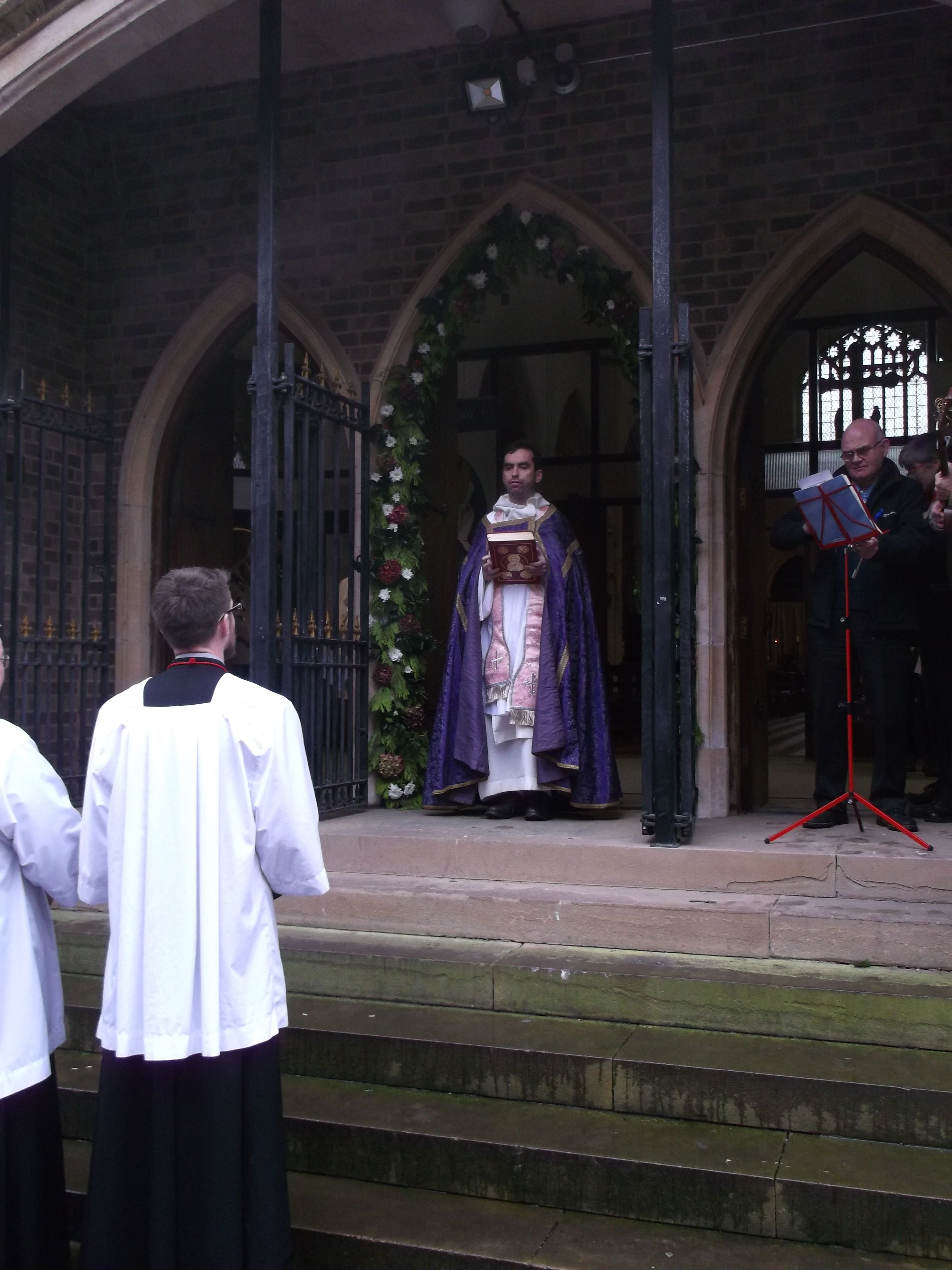 priest opens Holy Door